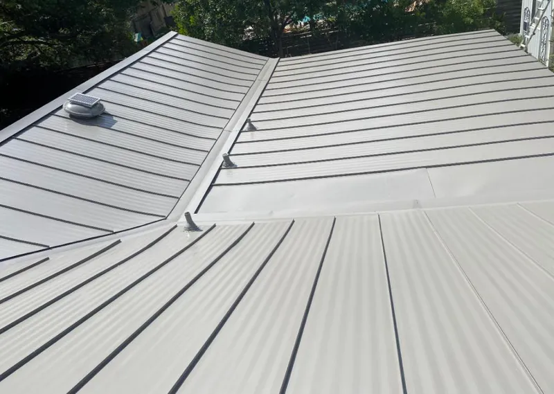 Solar attic fan installed on a metal roof for Roof Ventilation in Collegeville
